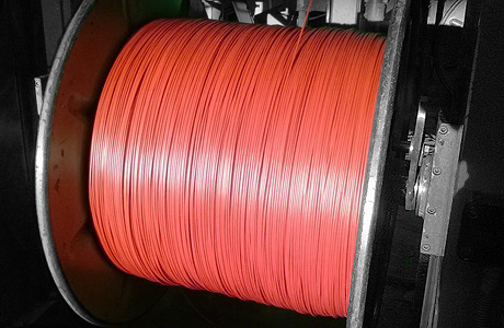 Fire proof cable in a take up machine
